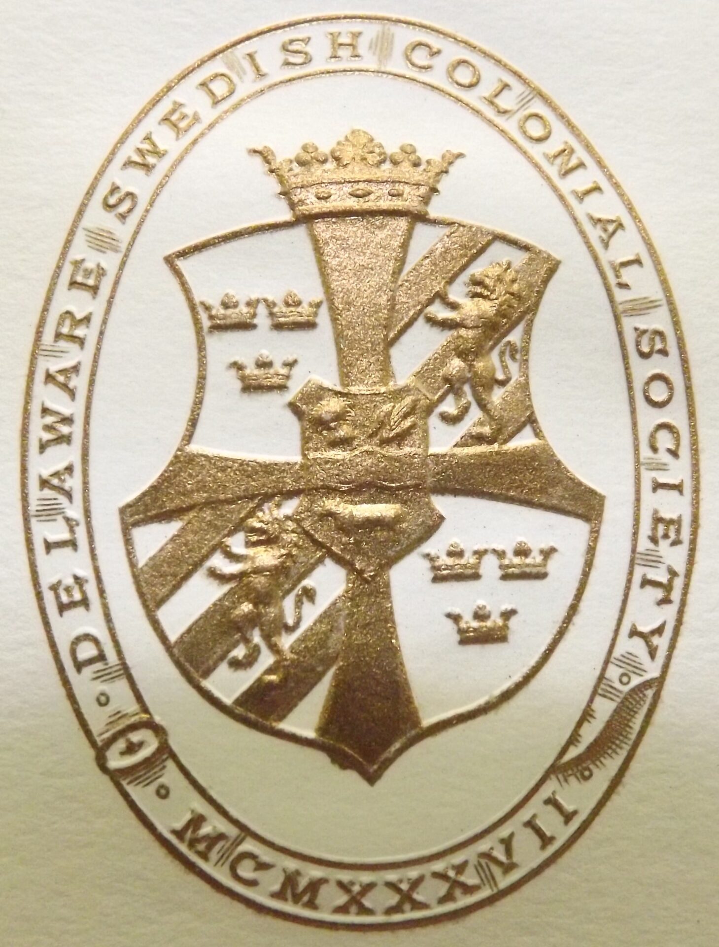 A close up of the crest on a card